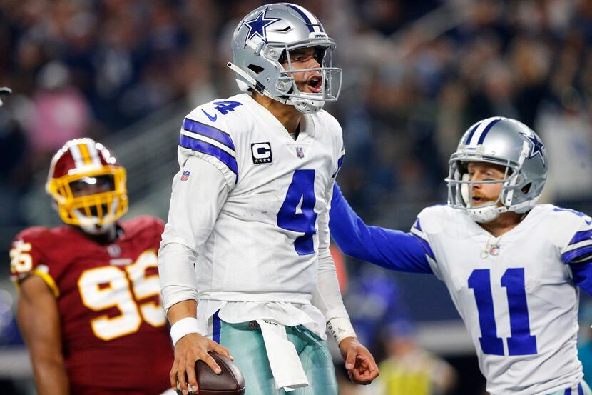 Dallas Cowboys quarterback Dak Prescott (4) celebrates his fourth quarter touchdown run...