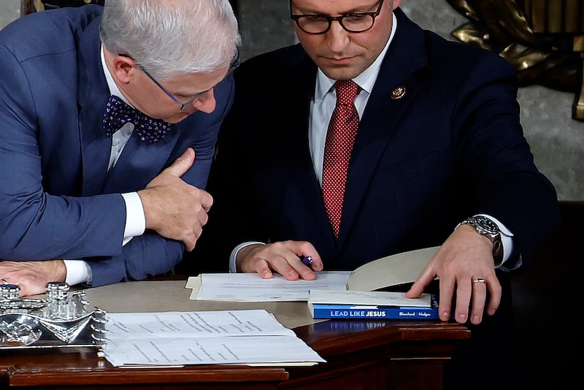 Acting Speaker Pro Tempore Rep. Patrick McHenry, R-N.C. (left) talks with Rep. Mike Johnson,...