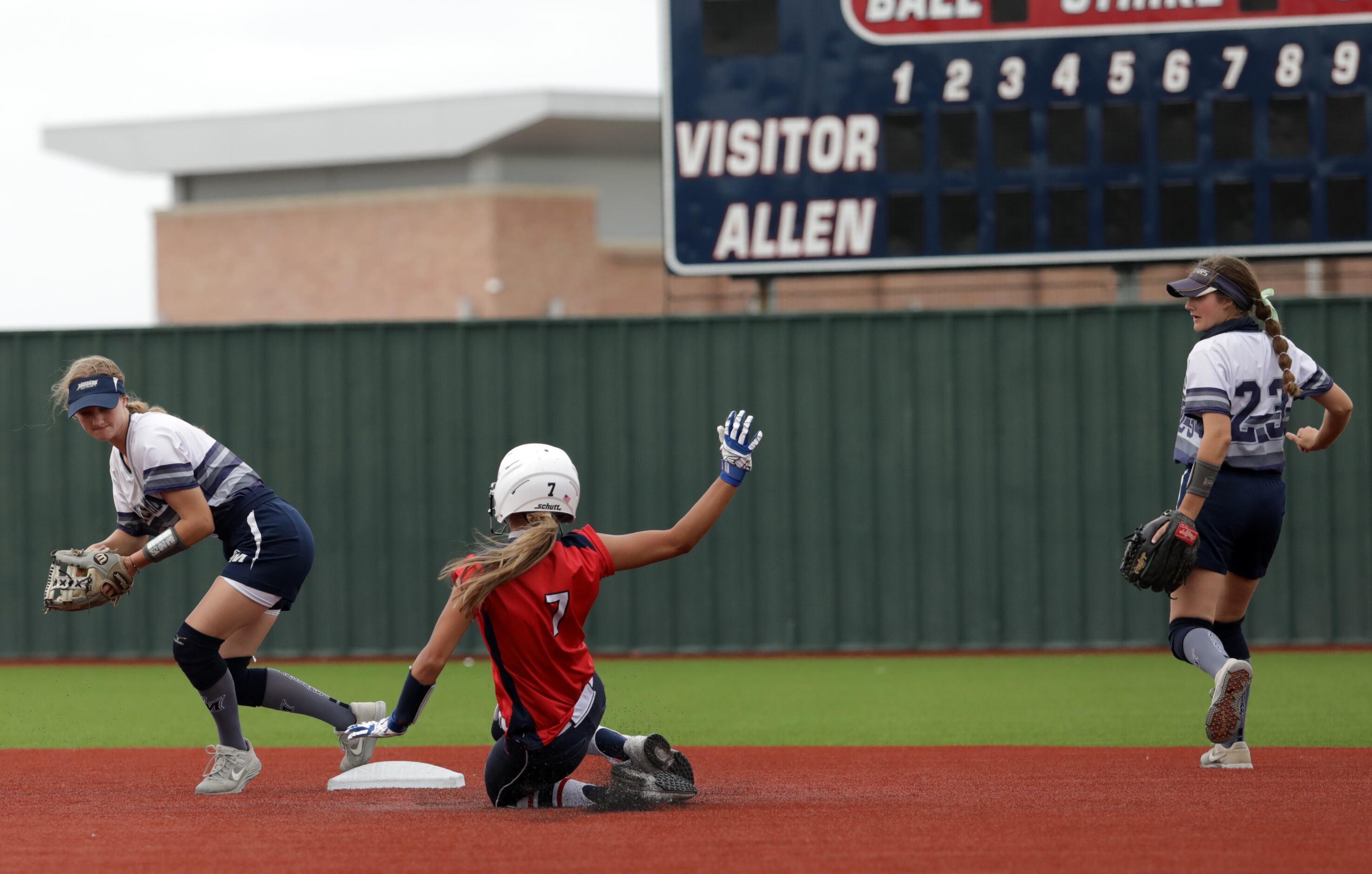 Flower Mound High School player #6, McKenna Andrews, stops Allen High School player #7,...