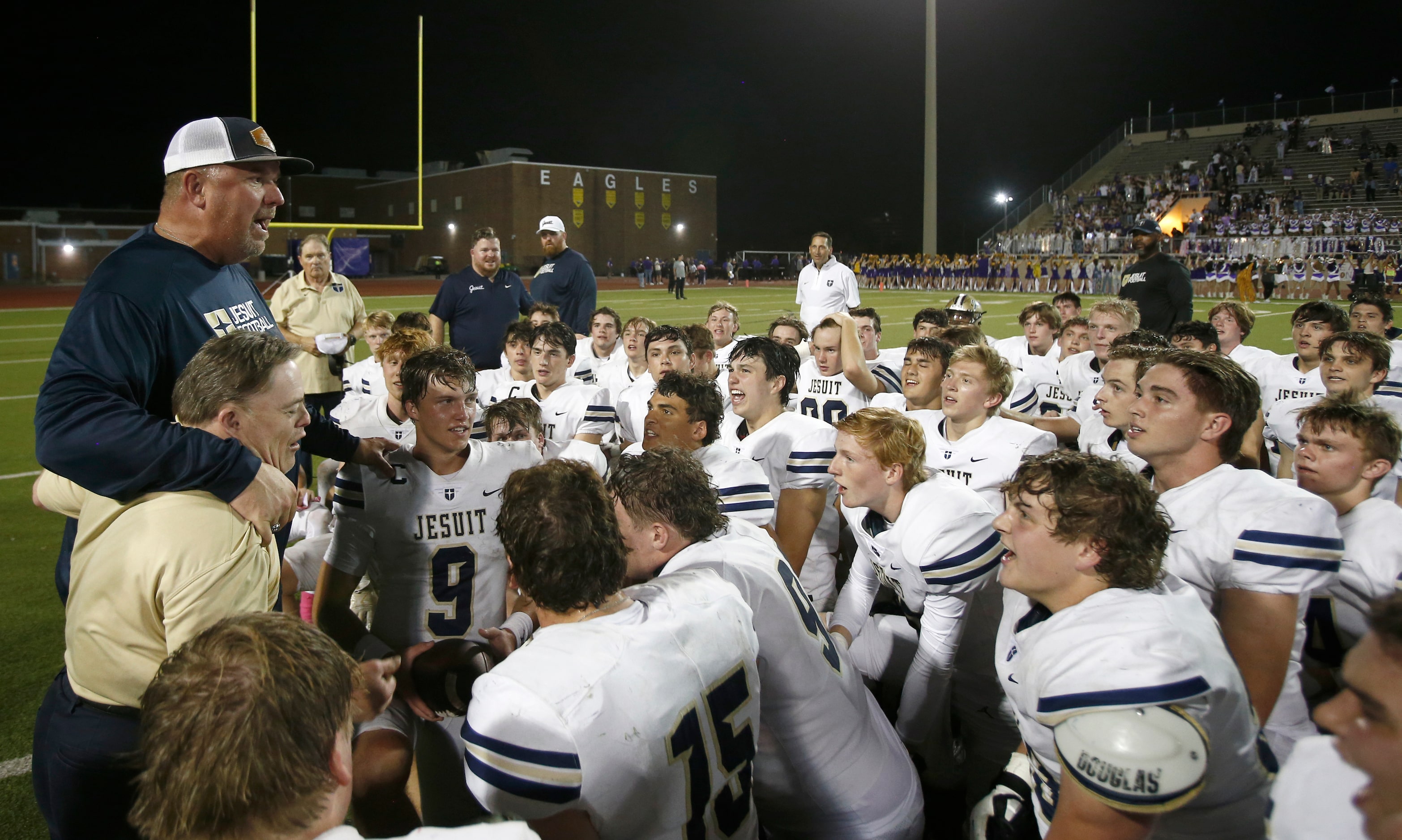 Jesuit head coach Brandon Hickman talks with his team after beating Richardson in a District...