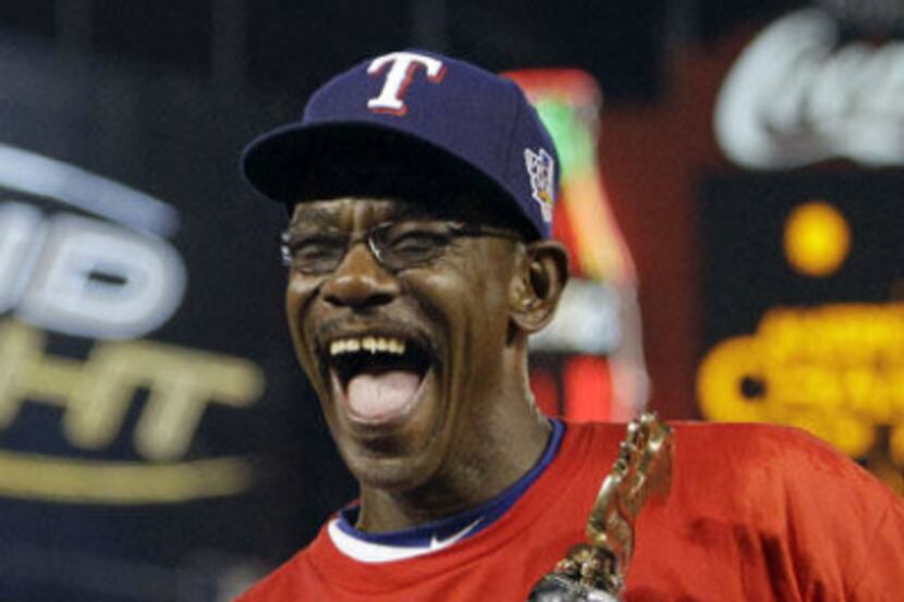 In this Oct. 22, 2010 file photo, Texas Rangers manager Ron Washington laughs with the...