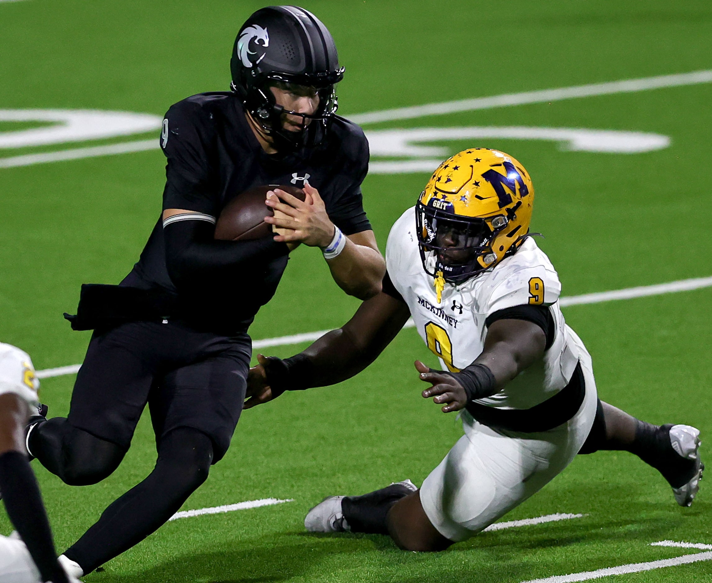 Denton Guyer quarterback Kevin Sperry (L) scrambles past McKinney defensive lineman Trevor...