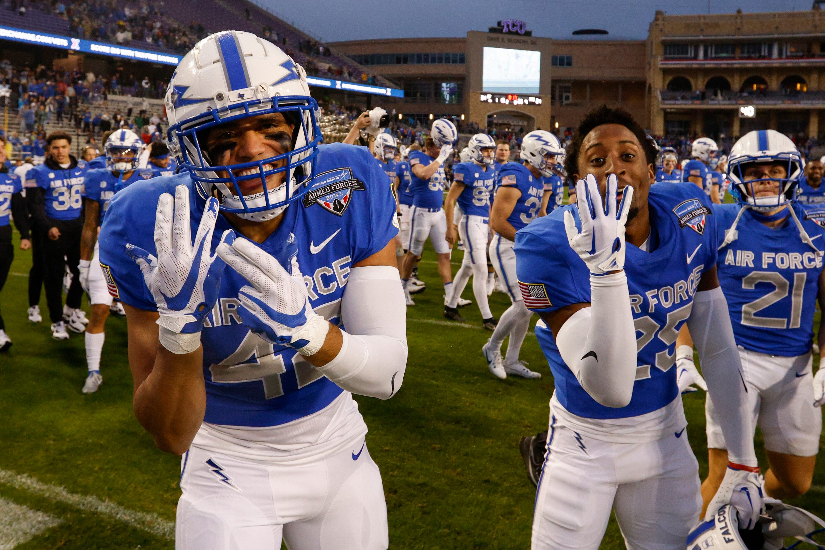 Air Force Falcons defensive back Jakobi McGowan (42) and running back Tylor Latham (25)...