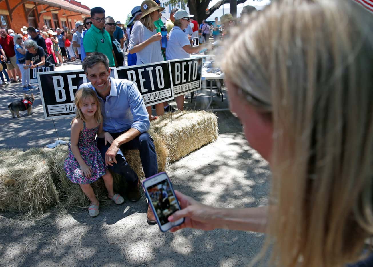 Chrissy Kleberg takes pictures of  her daughter Kathrine, 5, and U.S. Rep. Beto O'Rourke,...
