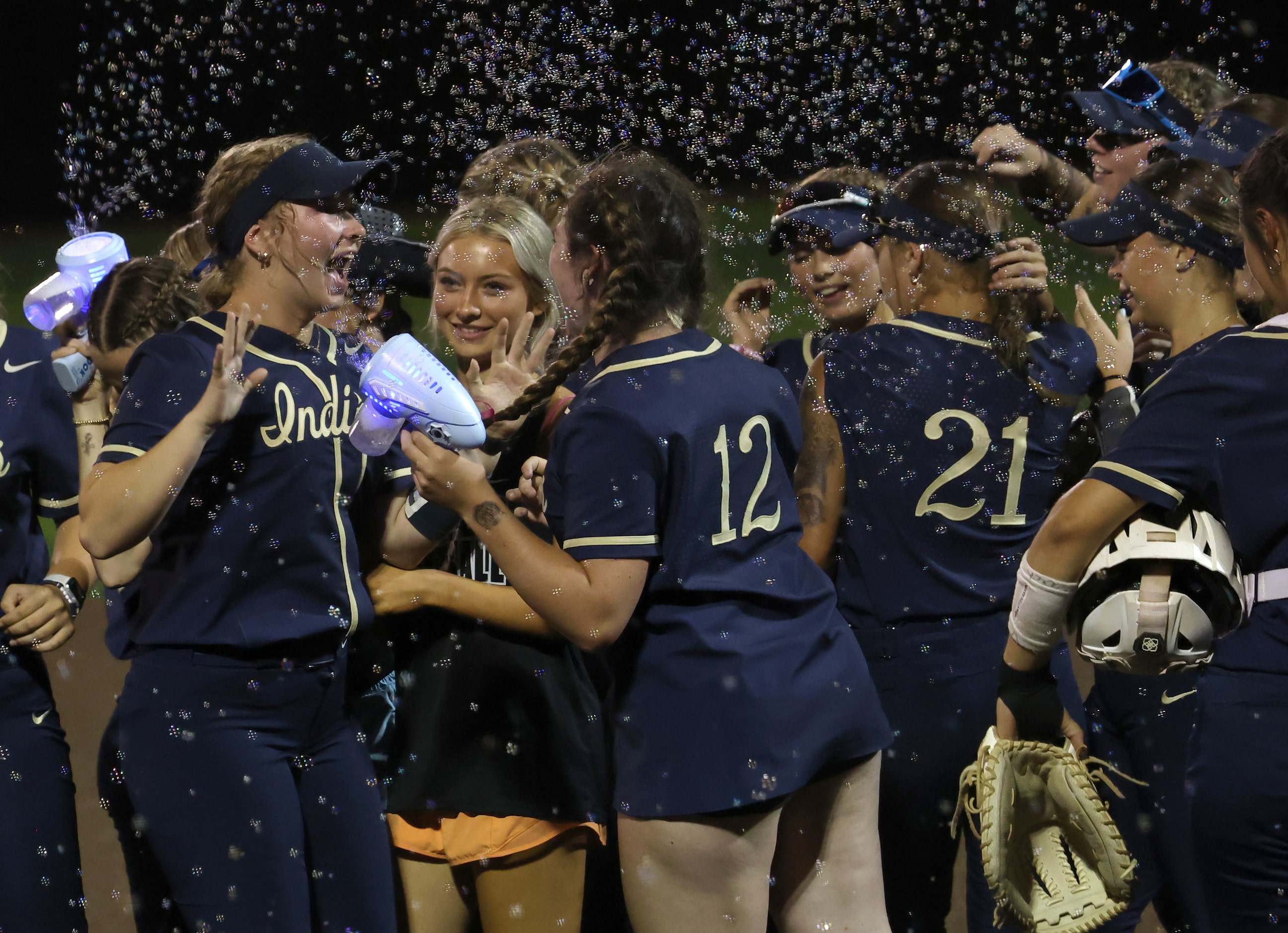 Euphoria and soap bubbles filled the air as Keller players celebrate following their 10-0...