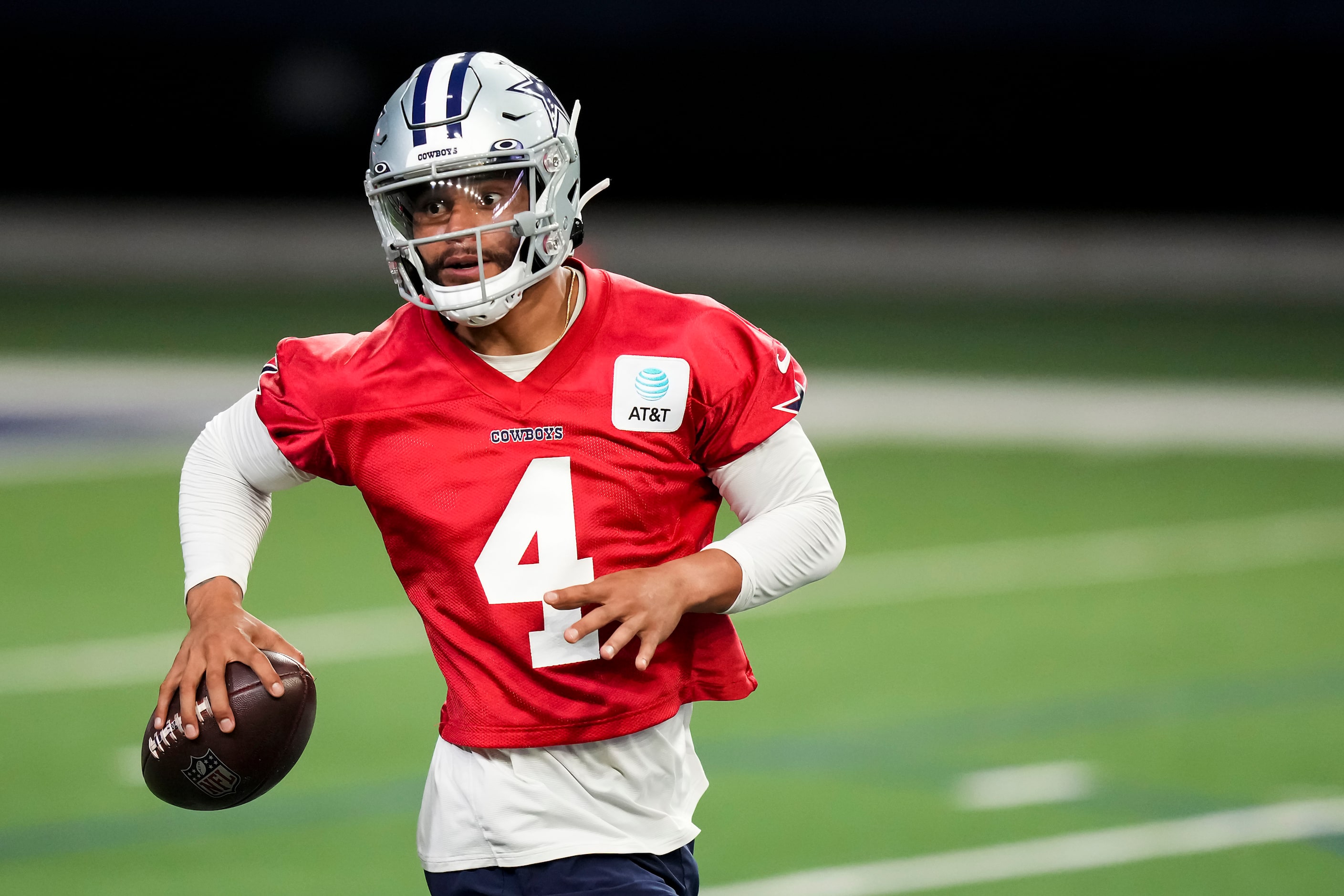 Dallas Cowboys quarterback Dak Prescott (4) throws a pass during the OTA team's practice at...