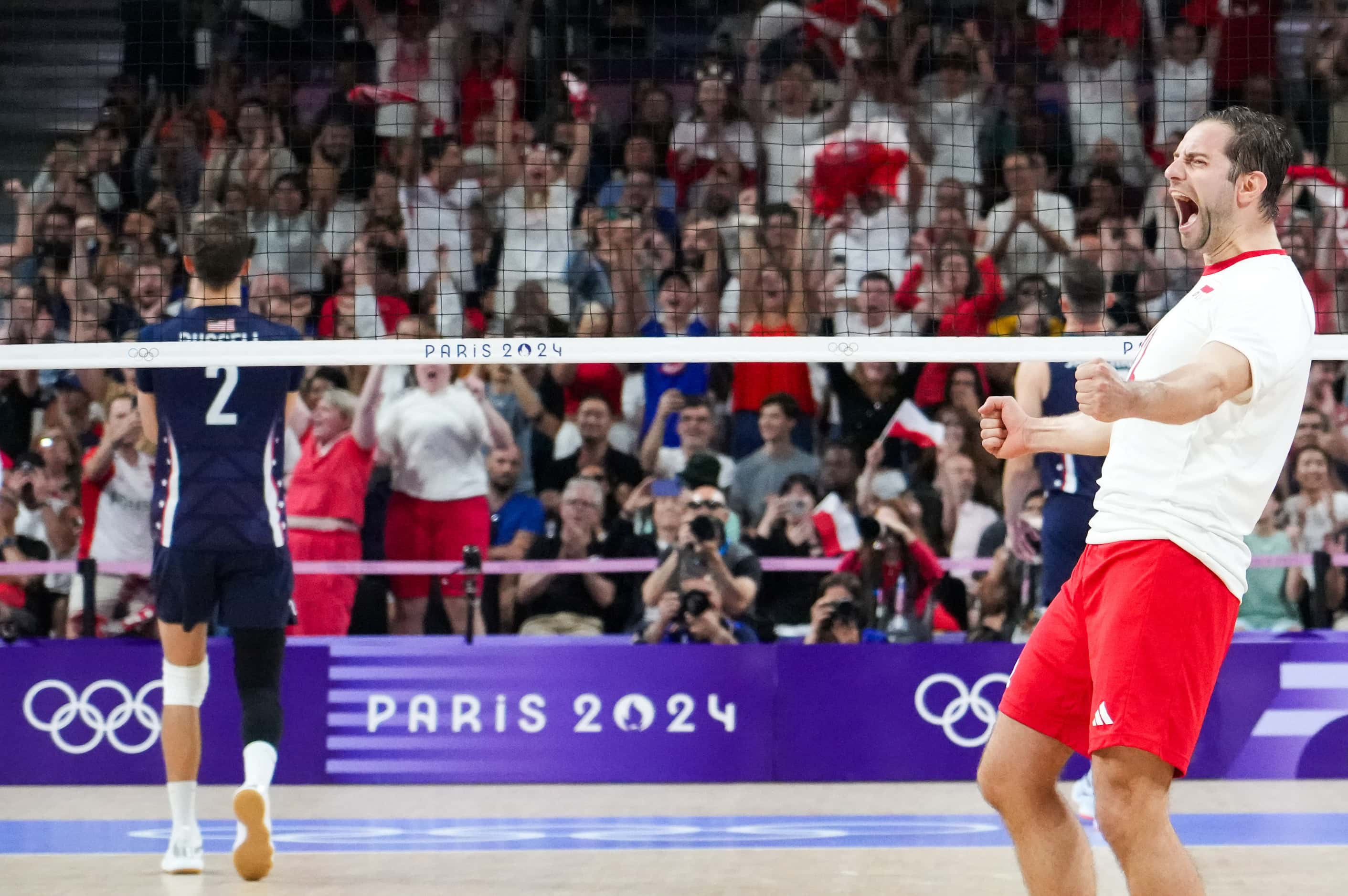 Grzegorz Lomacz of Poland celebrates after a point during a men’s volleyball semifinal...