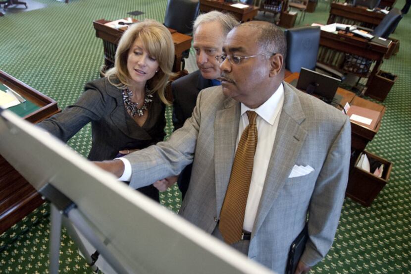 The Legislature's map, looked over by 
Democratic state Sens. Wendy Davis of Fort Worth...
