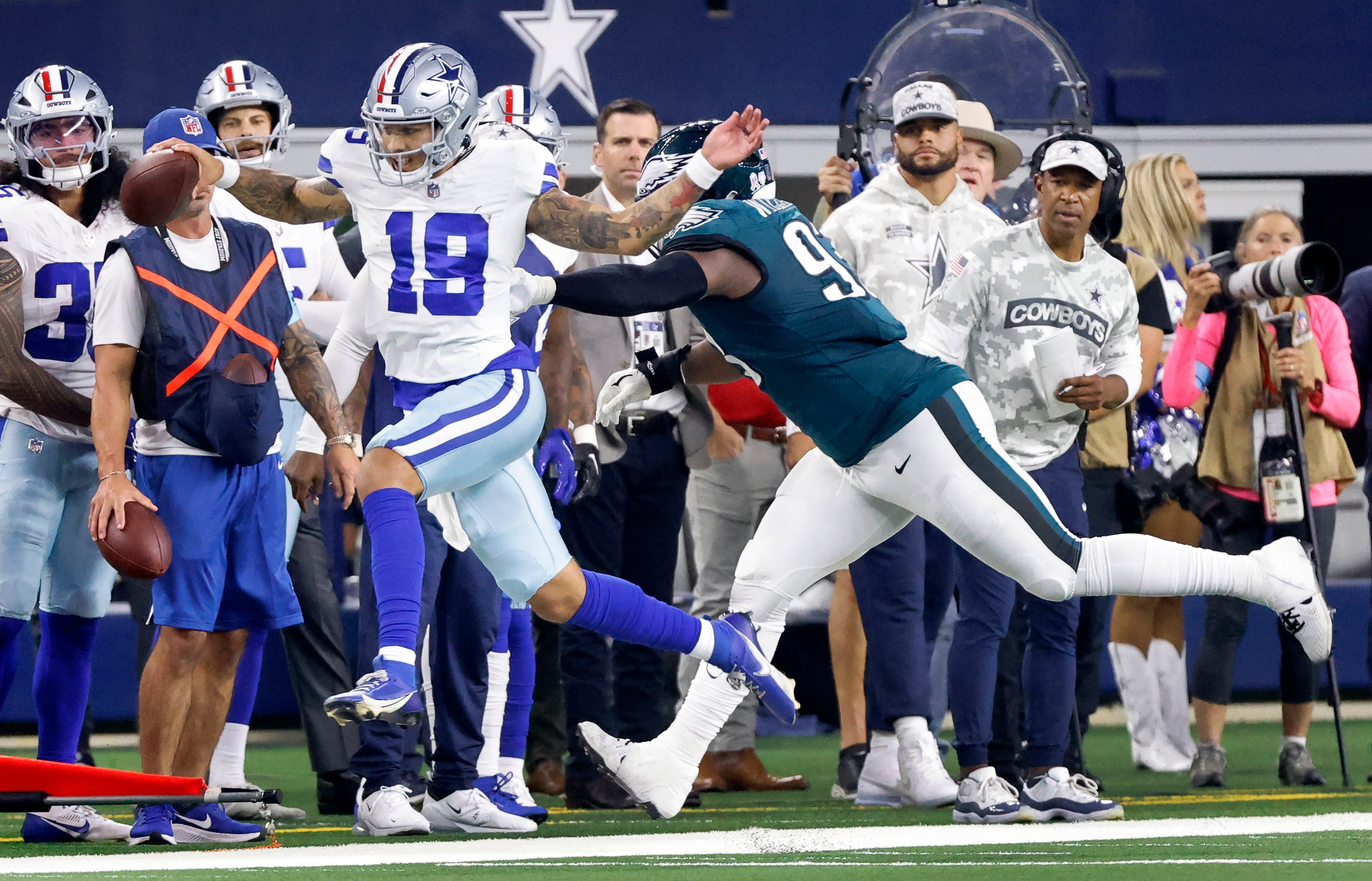 Dallas Cowboys quarterback Trey Lance (19) is pushed out of bounds by Philadelphia Eagles...