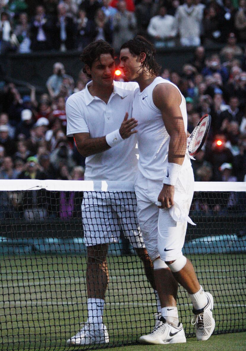 Spain's Rafael Nadal (R) is congratulated by Switzerland's Roger Federer after winning their...