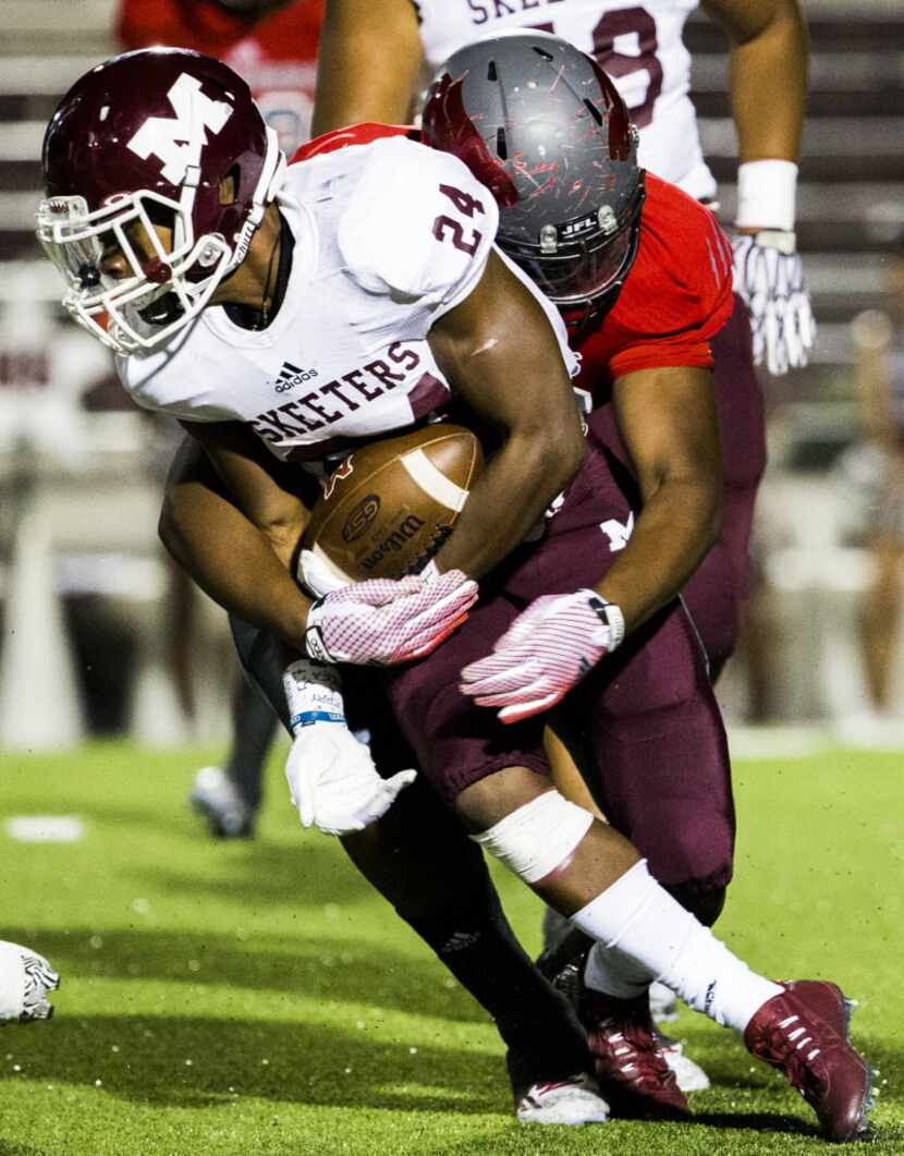 Mesquite running back Chance Fisher (24) is tackled by Mesquite Horn defensive lineman...