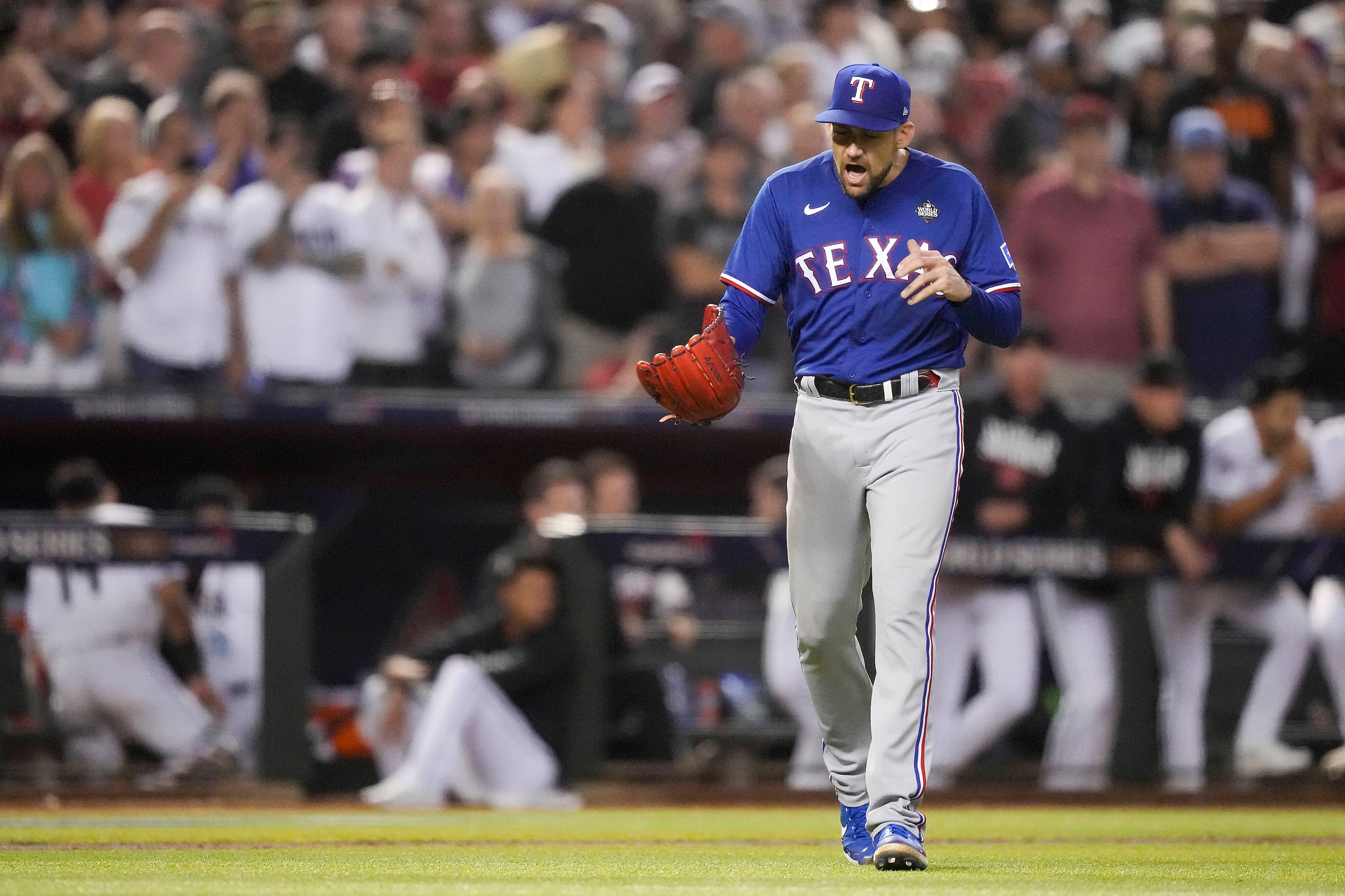 Texas Rangers starting pitcher Nathan Eovaldi celebrates the final out with the bases loaded...