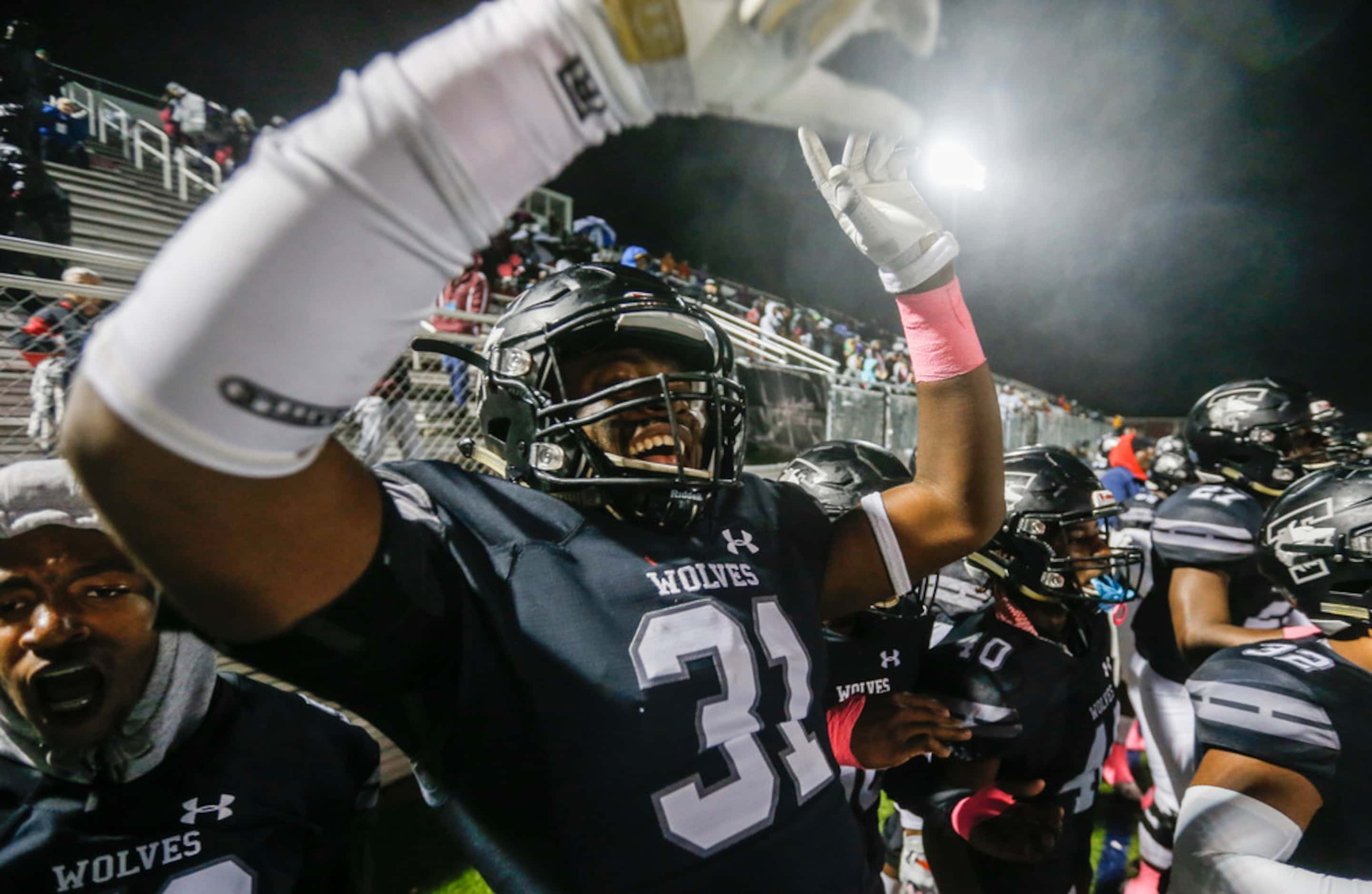 Mansfield Timberview linebacker Brandon Donald (31) celebrates a turnover on downs during a...