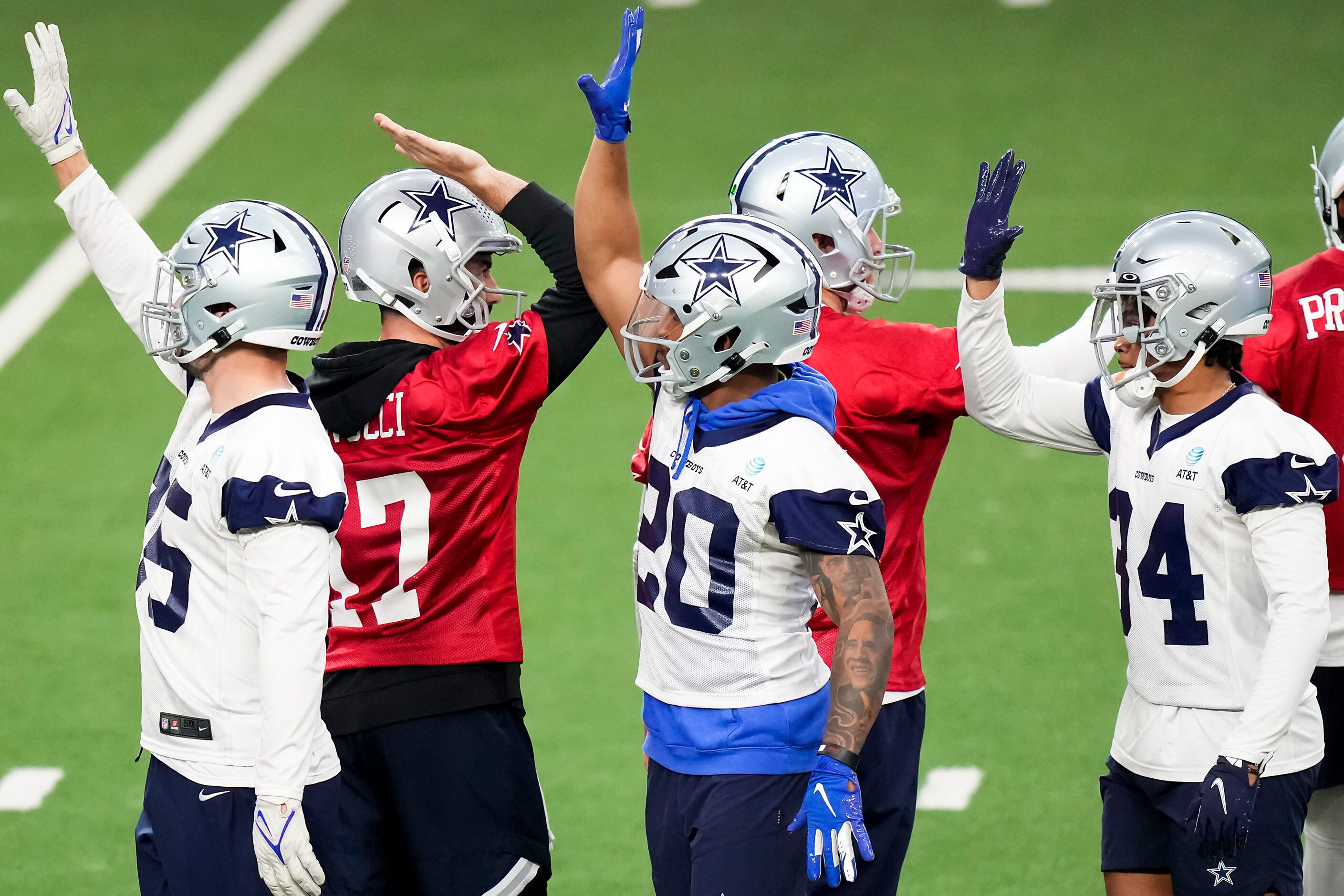 Dallas Cowboys players, including quarterback Ben DiNucci (17), running back Tony Pollard...