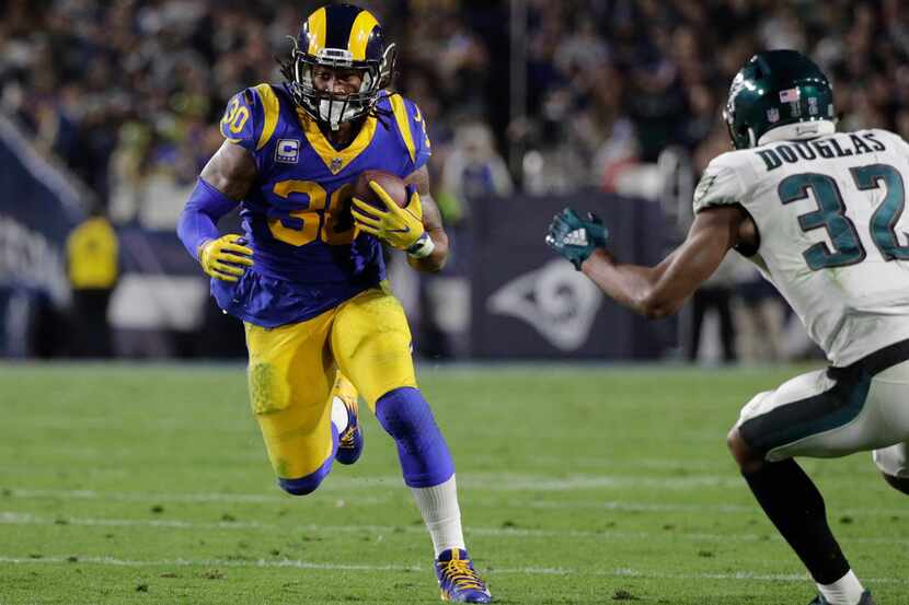 File-This photo taken Dec. 16, 2018, shows Los Angeles Rams' Todd Gurley carrying the ball...