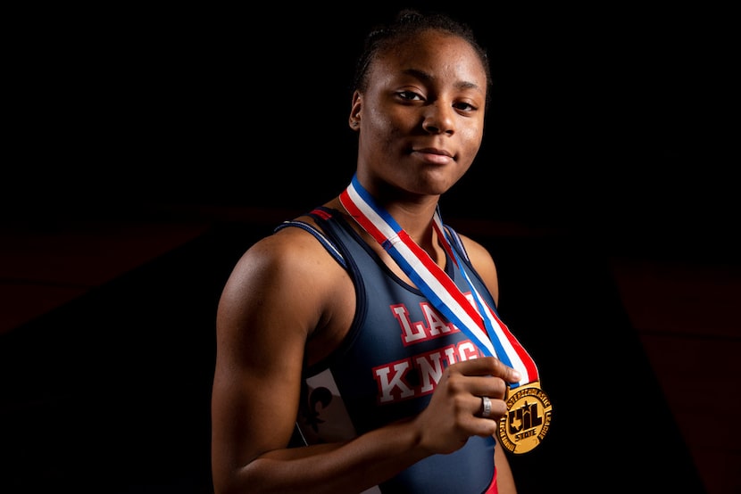 Wrestler Destiny Miles poses for a photograph at Kimball High School in Dallas on Thursday,...