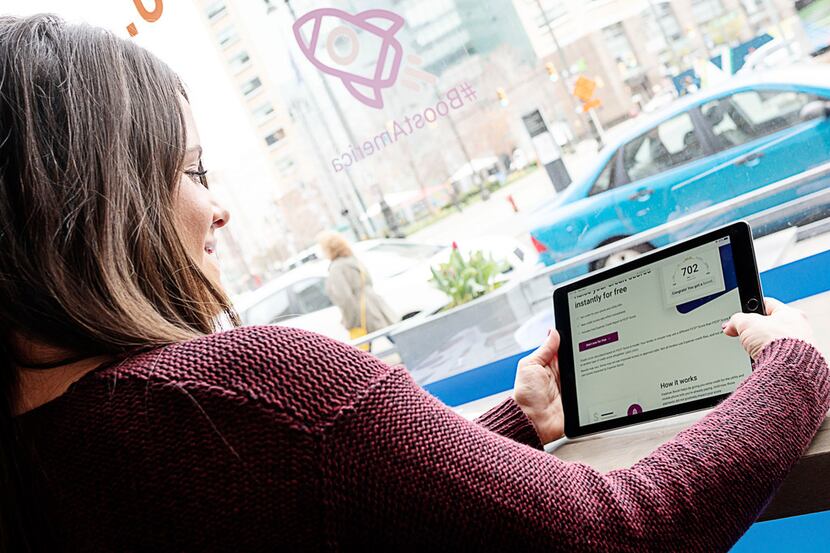 New York City resident Tiffany Trilli, 25, visited the Experian Boost website on a tablet to...