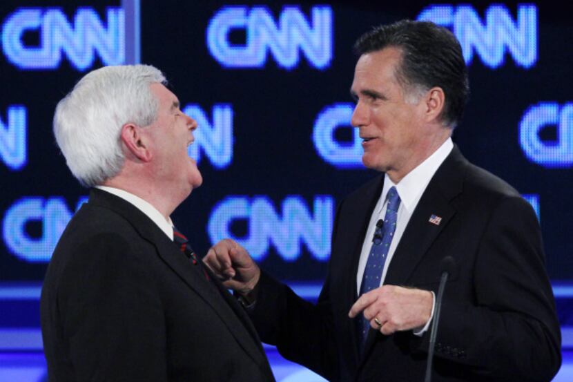 Mitt Romney (right) began pressing Newt Gingrich right off the bat in Thursday night’s...