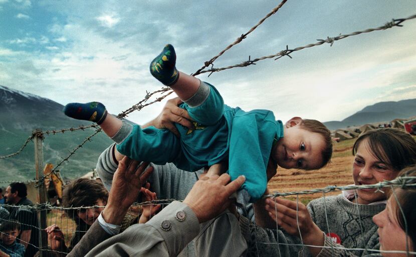 In this photo, part of Carol Guzy's Pulitzer Prize-winning portfolio, Kosovar refugee Agim...