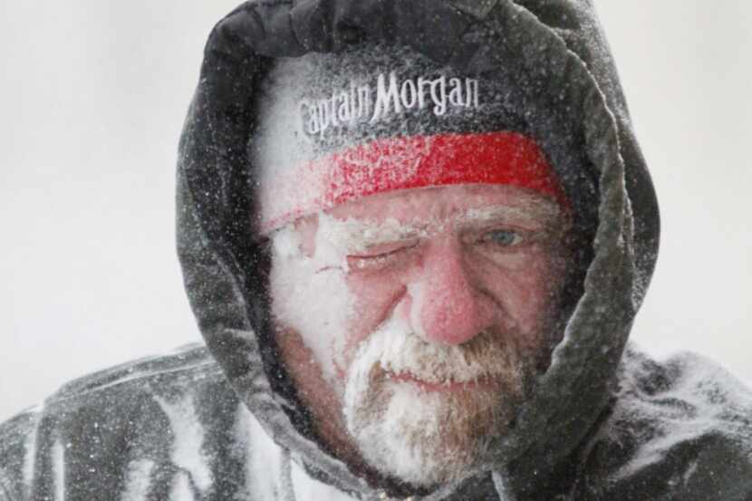 Allan Umscheid was somewhat the worse for wear while running a snowblower in Lawrence, Kan.,...