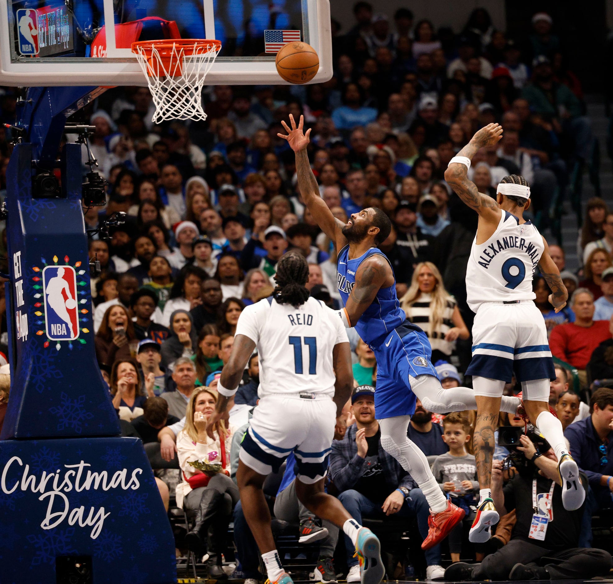 Dallas Mavericks guard Kyrie Irving (11) shoots the ball as Minnesota Timberwolves center...