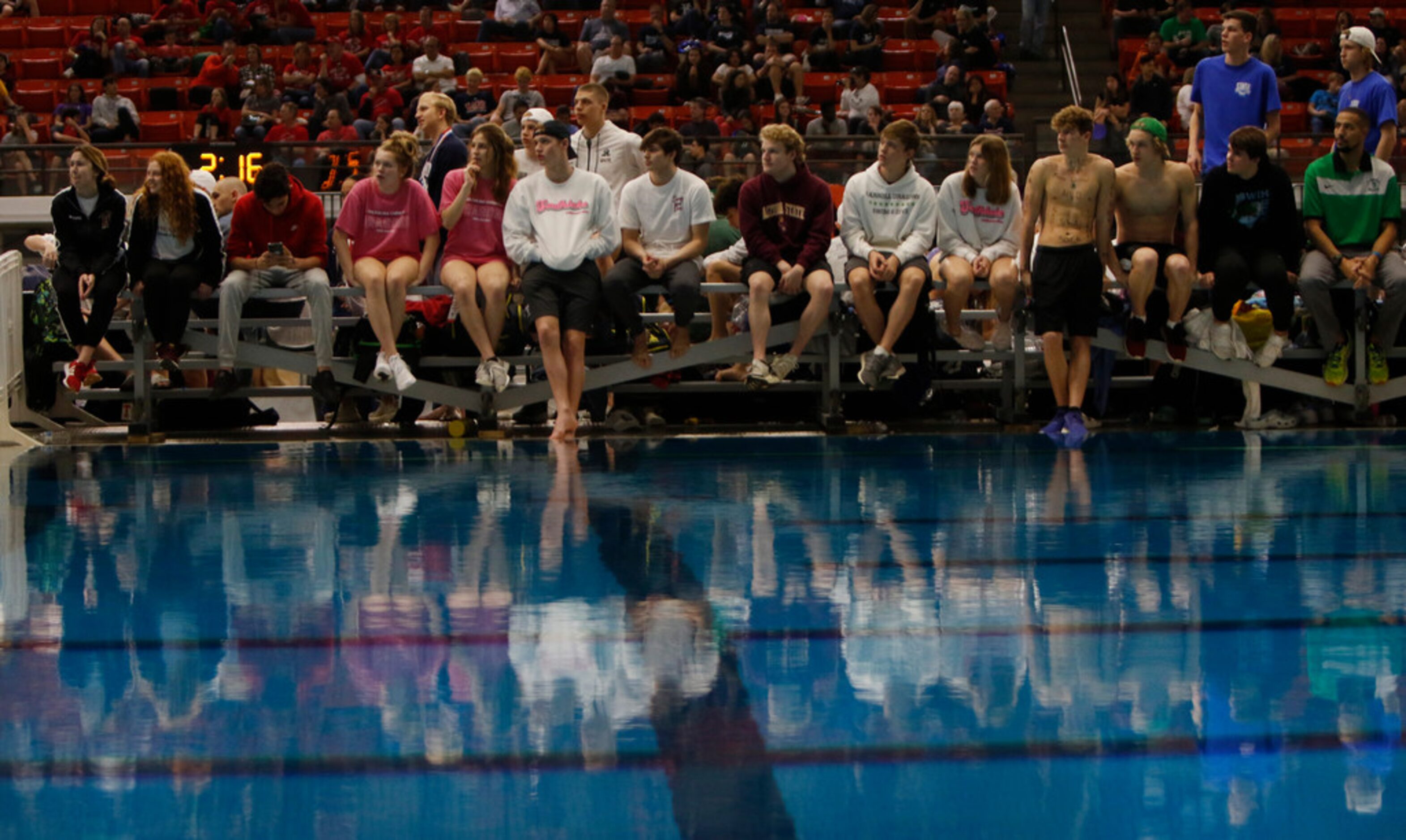 Southlake Carroll supporters await at poolside for Jackson Miller's second diving attempt...