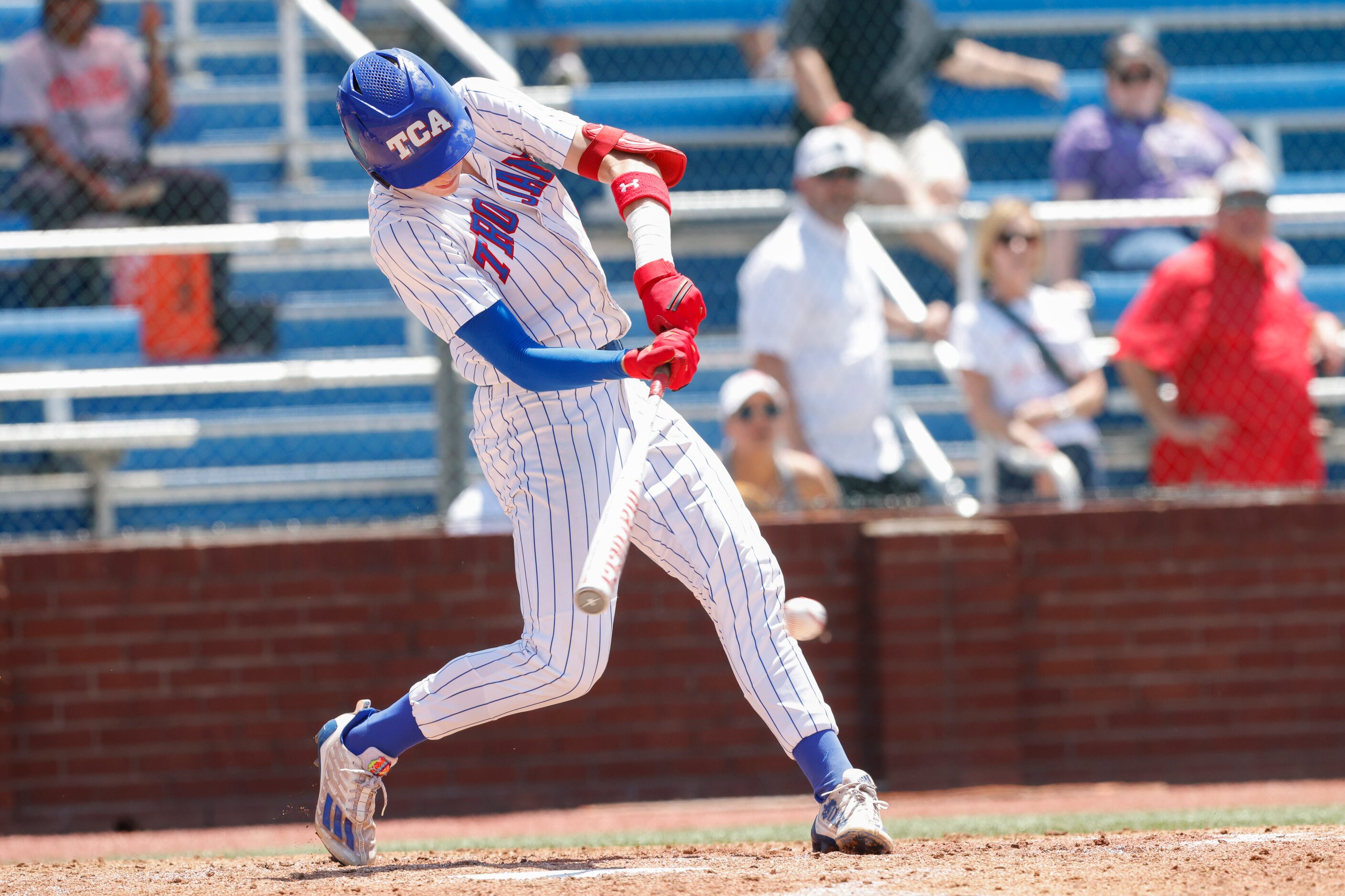 Trinity Christian’s Abe Woods (2) hits the ball in the second inning against Houston St....