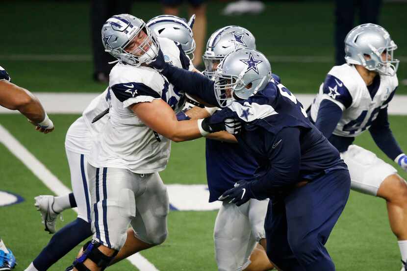 Cowboys defensive tackle Antwaun Woods (99) tries to get by offensive guard Connor Williams...