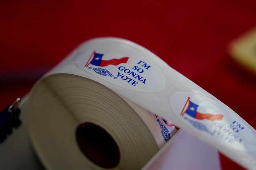 Voting stickers are seen at a political event for Texas Democratic gubernatorial candidate...