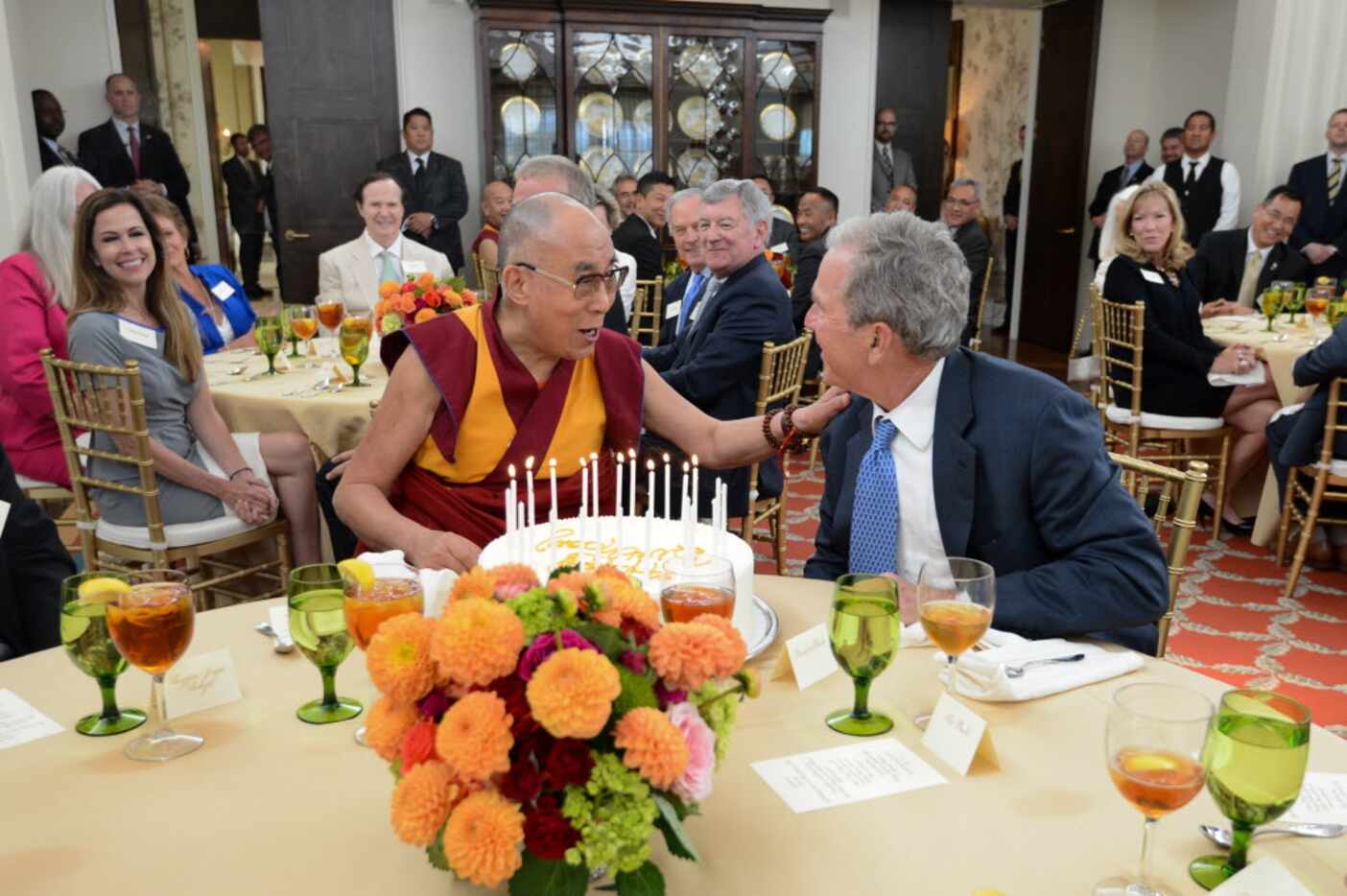 The 14th Dalai Lama visited the Bush Center in 2015. He's shown with former President George...