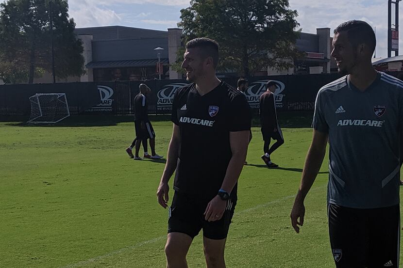 Kenny Cooper (left) and Matt Hedges chuckle at a teammate after FC Dallas training. (9-11-19)