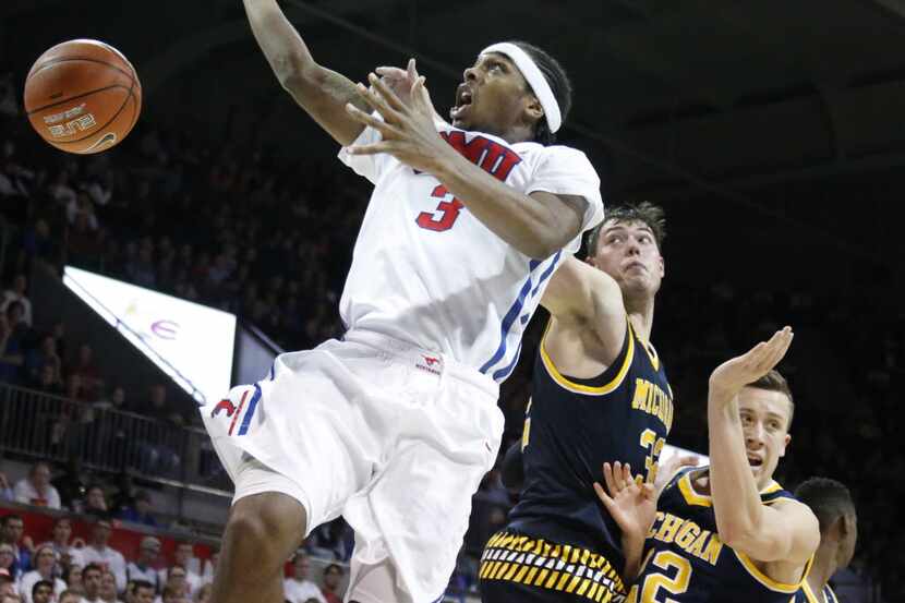 Southern Methodist Mustangs guard Sterling Brown (3) is fouled as he loses control of the...