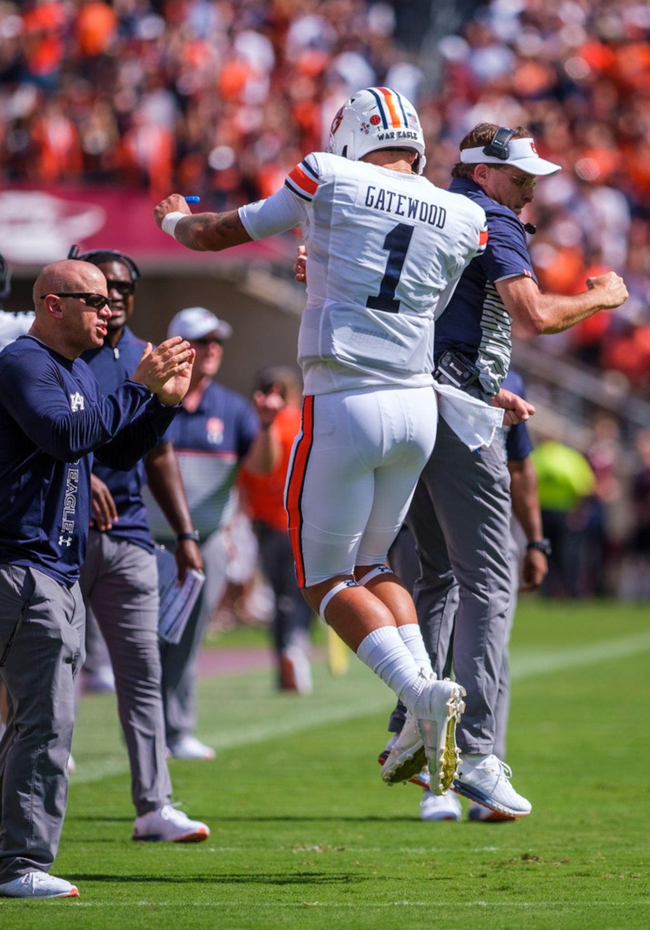 Auburn head coach Gus Malzahn celebrates with quarterback Joey Gatewood (1) after a Tigers...