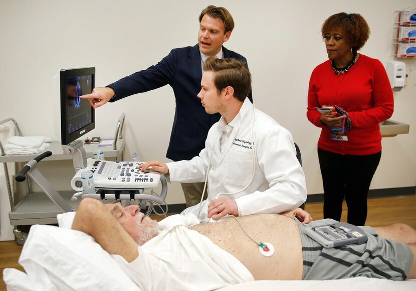 Michael D. Nelson, Applied Physiology and Advanced Imaging Laboratory director, points to...