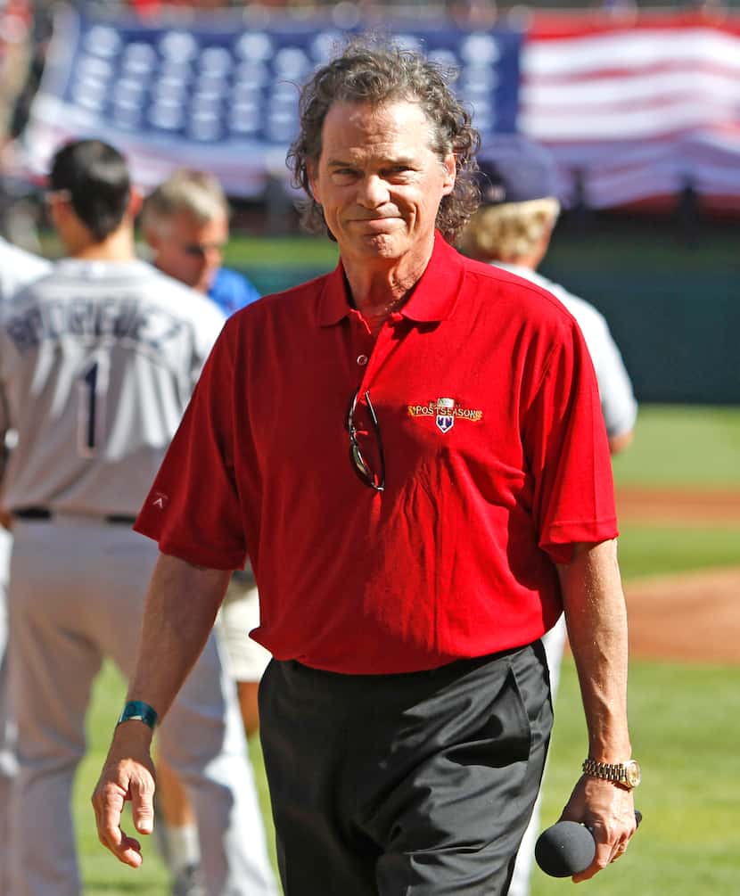 Singer B.J. Thomas walks off the field after singing the National Anthem before the American...