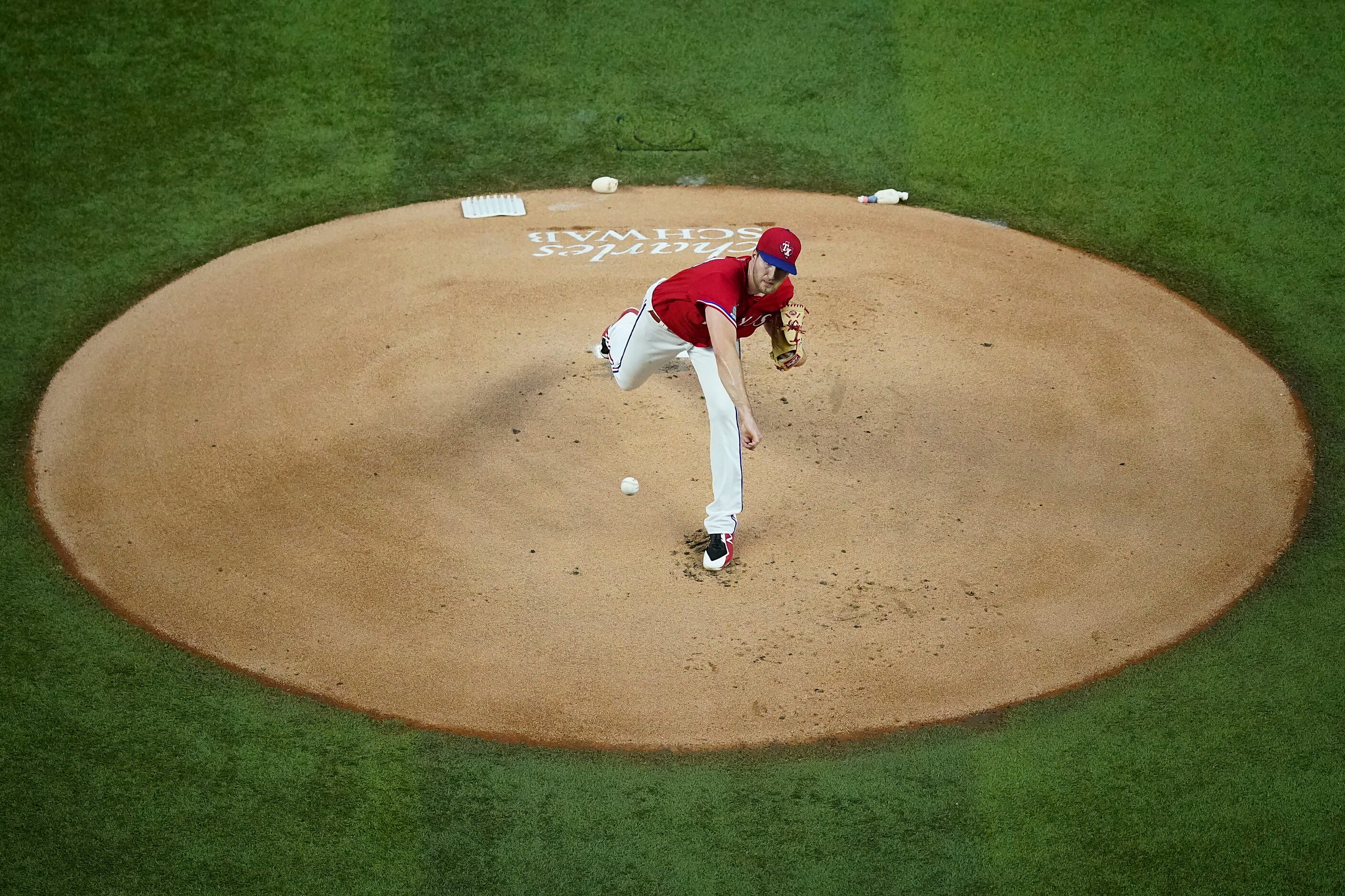 Texas Rangers pitcher Kyle Cody delivers during the first inning against the Houston Astros...