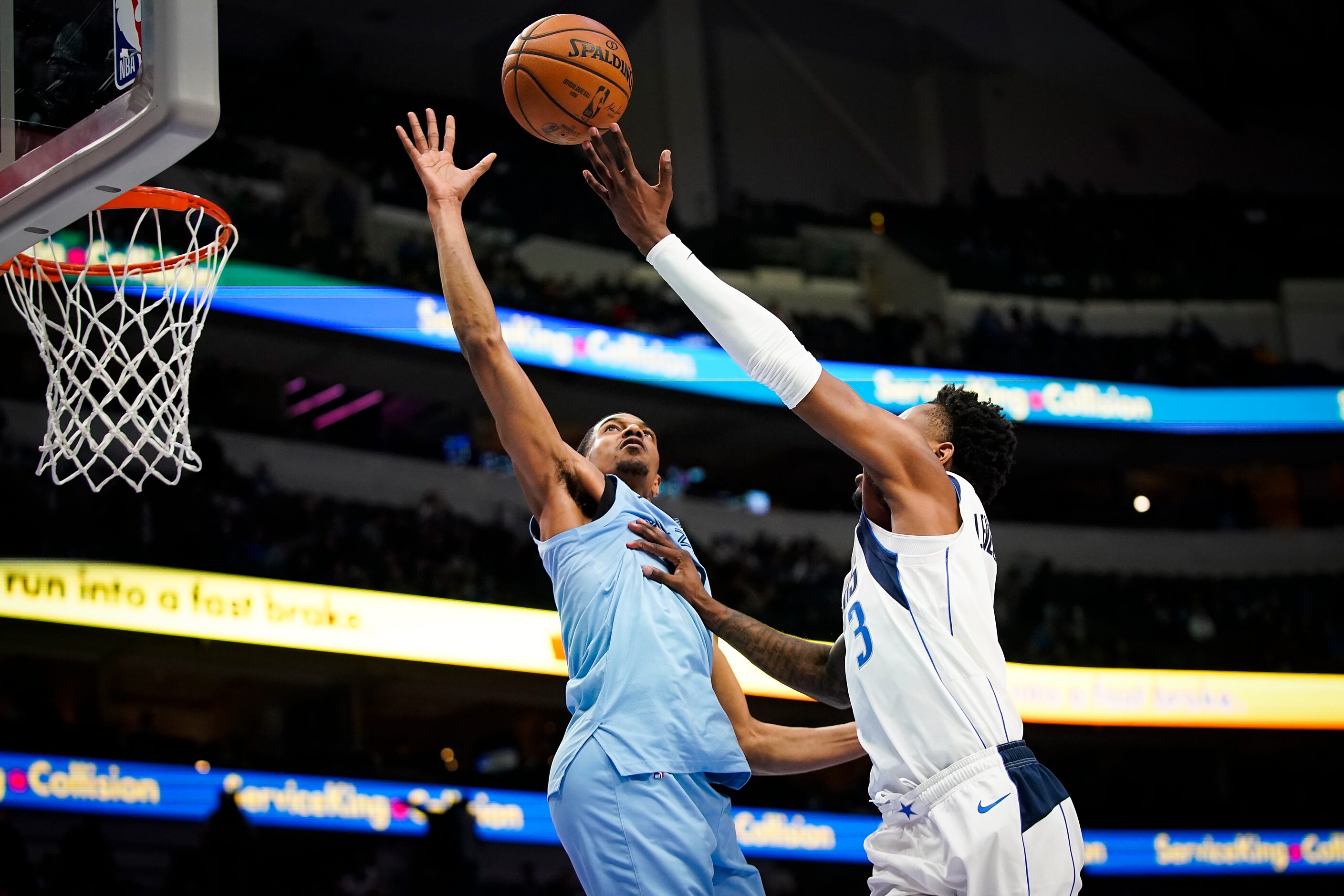 Memphis Grizzlies guard De'Anthony Melton (0) blocks a shot by Dallas Mavericks guard...