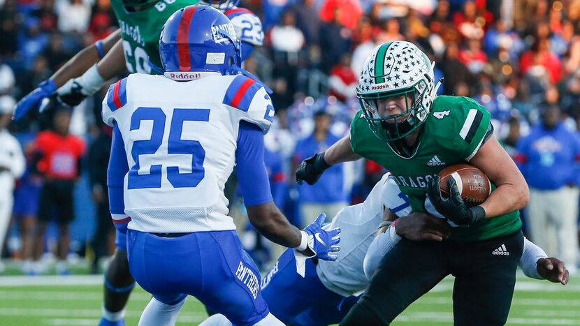 Southlake Carroll running back Owen Allen (4) walks in a touchdown during the second half of...