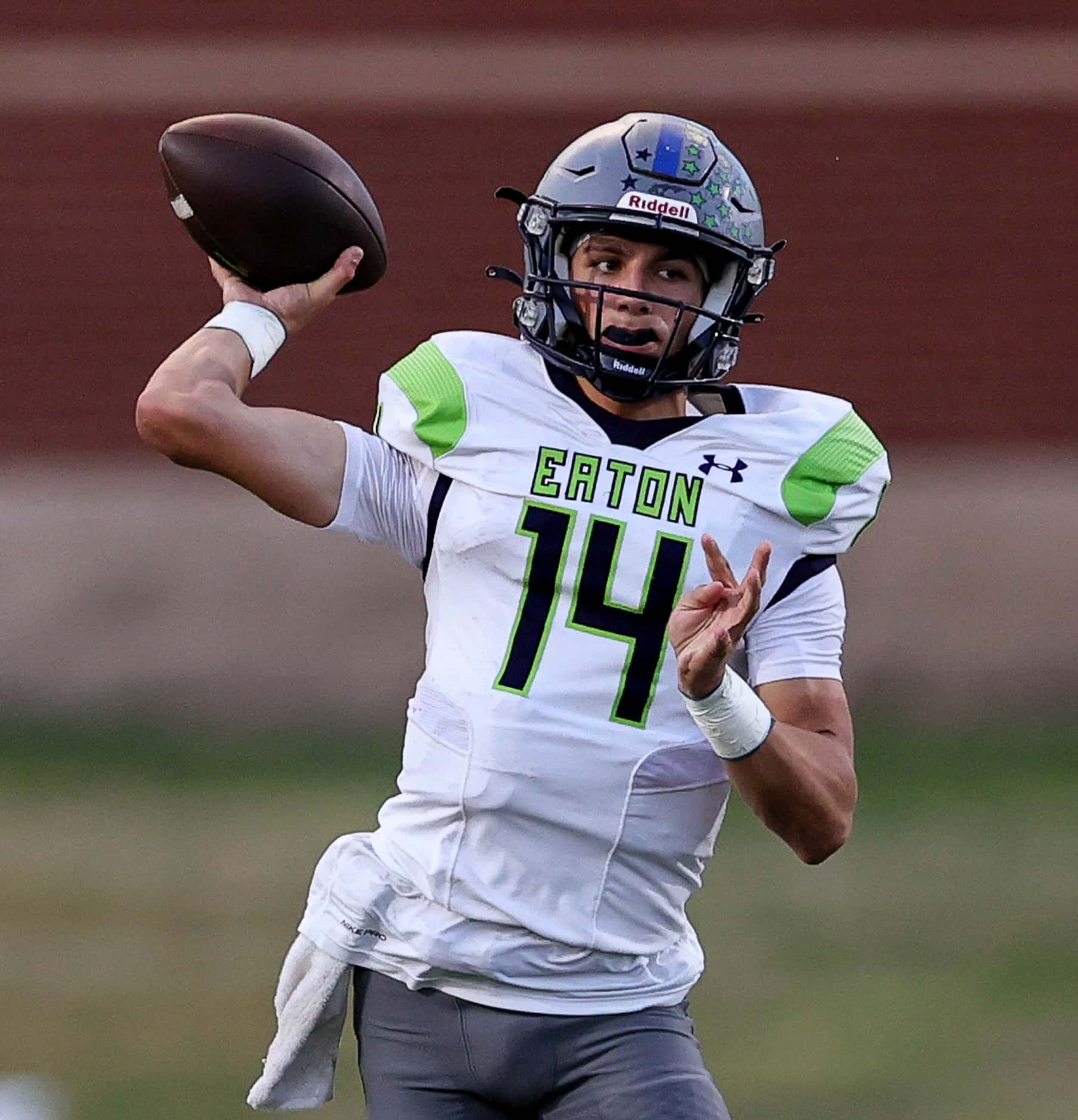 Eaton quarterback Noah Lugo looks to make a pass against Hebron during the first half of a...