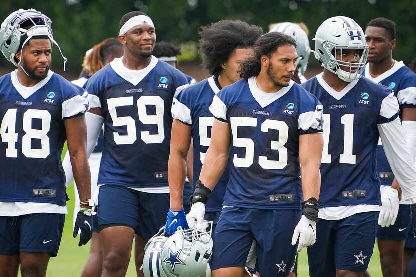 Dallas Cowboys linebacker Jabril Cox (48), defensive end Chauncey Golston (59), linebacker...