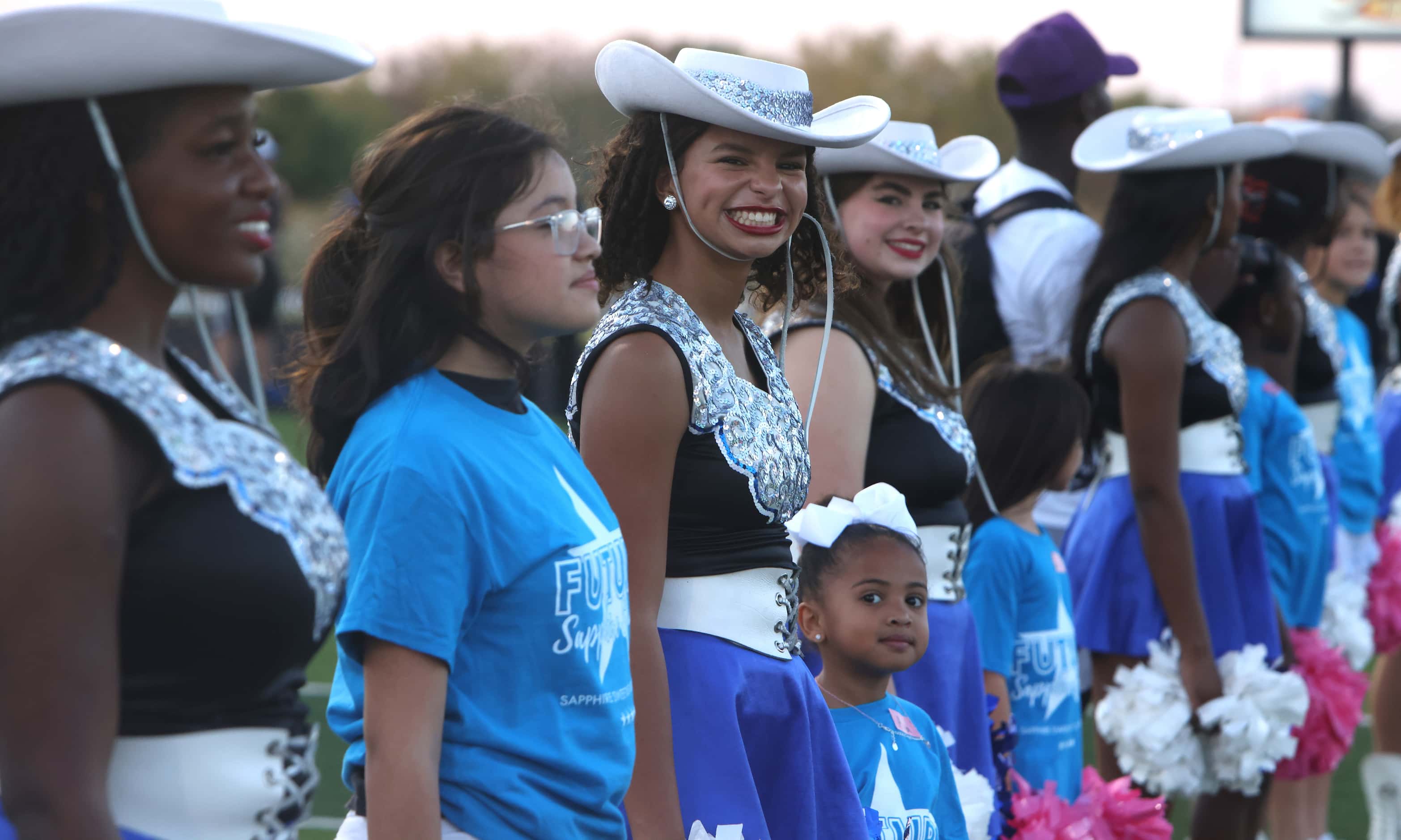 Members of the North Forney drill team wait for team introductions prior to the opening...