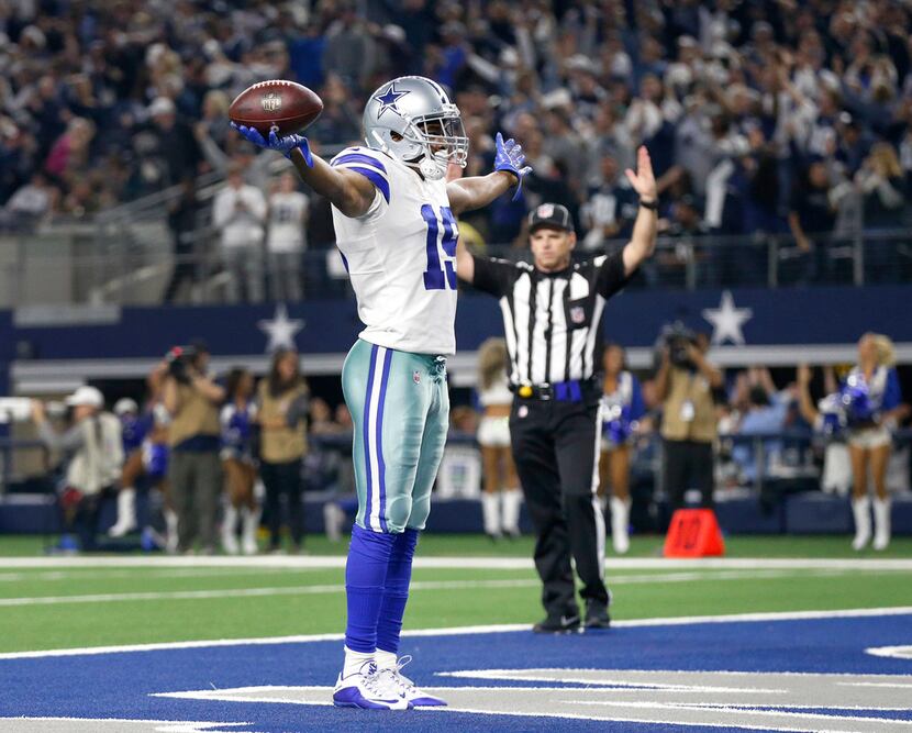 FILE - Cowboys wide receiver Amari Cooper (19) celebrates a fourth-quarter touchdown against...