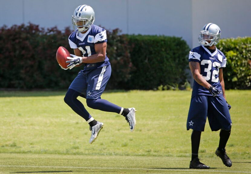 Dallas Cowboys cornerback Orlando Scandrick (32) watches as rookie cornerback Byron Jones...