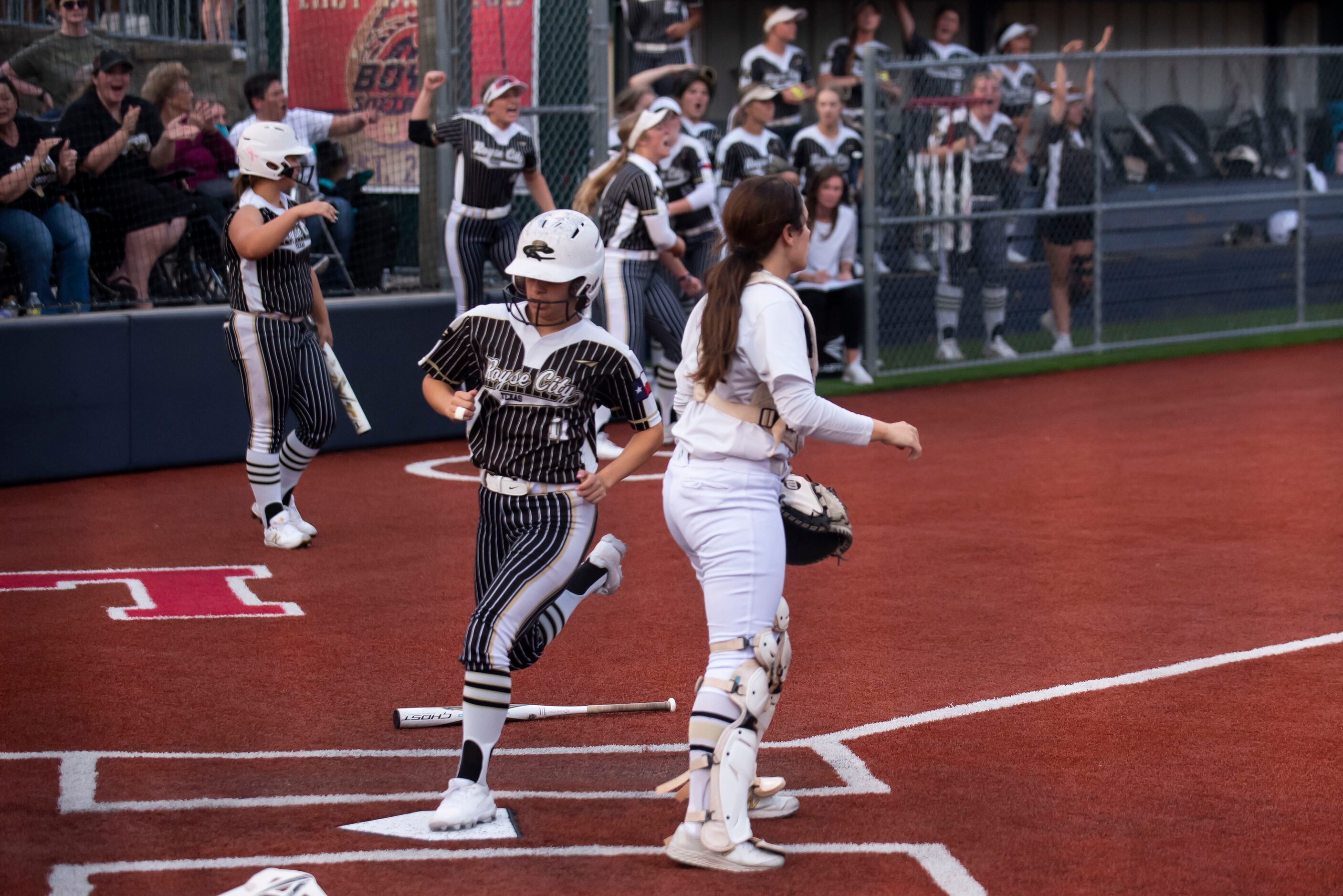 Royse City’s Haley Alaniz (11) scores a run during game two of the Class 5A Softball Region...