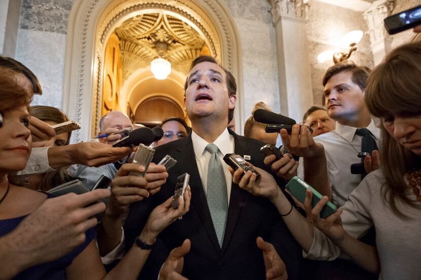 Sen. Ted Cruz, R-Texas, emerges from the Senate Chamber after his overnight crusade railing...