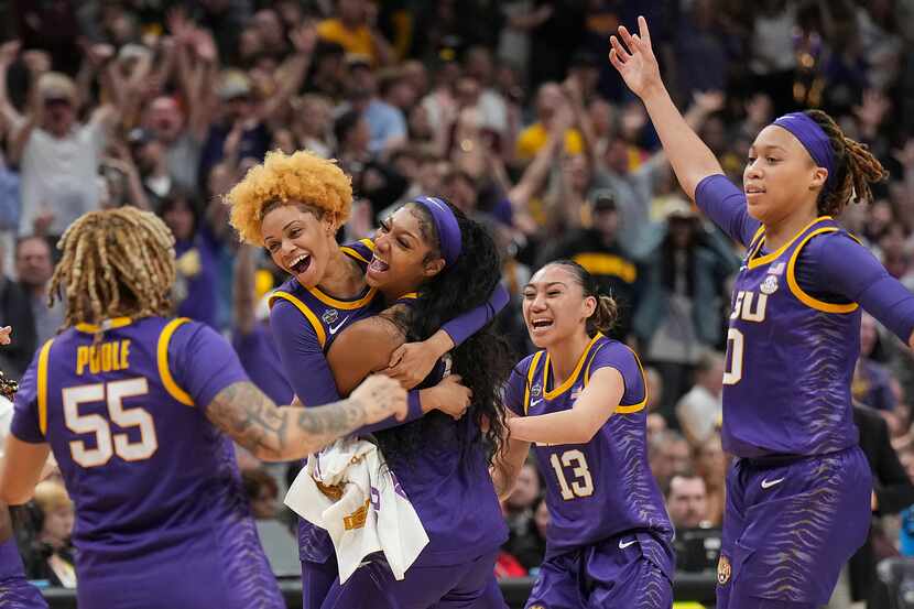 LSU guard Jasmine Carson (2) celebrates with forward Angel Reese (10) along with guard...