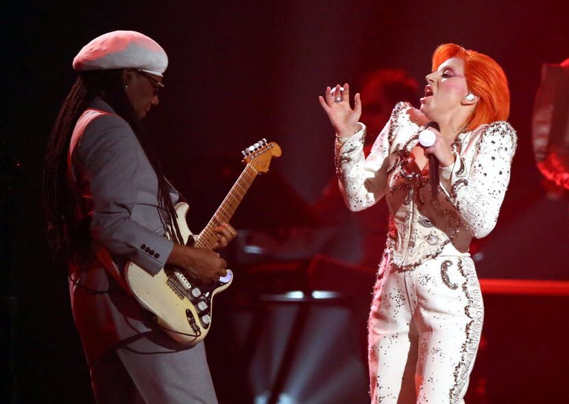Nile Rodgers, left, and Lady Gaga perform a tribute to David Bowie at the 58th annual Grammy...