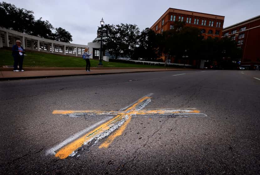 An X on Elm Street marks the spot where the second shot hit President John F. Kennedy...