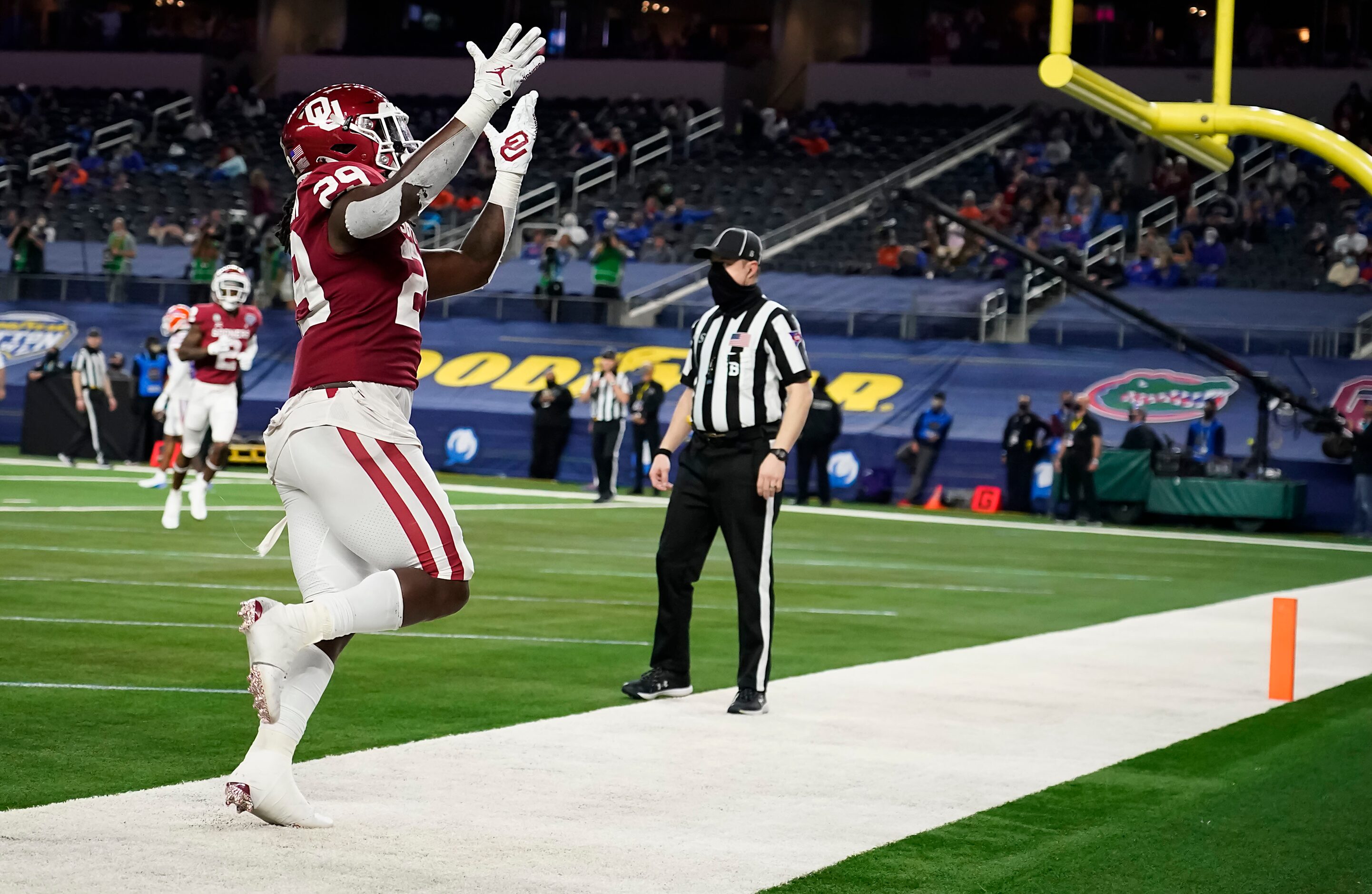 Oklahoma running back Rhamondre Stevenson celebrates after scoring on a 15-yard touchdown...