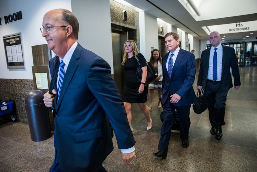 Defense attorneys Robert Rogers (left), Toby Shook (second from right) and Zach Horn (right)...